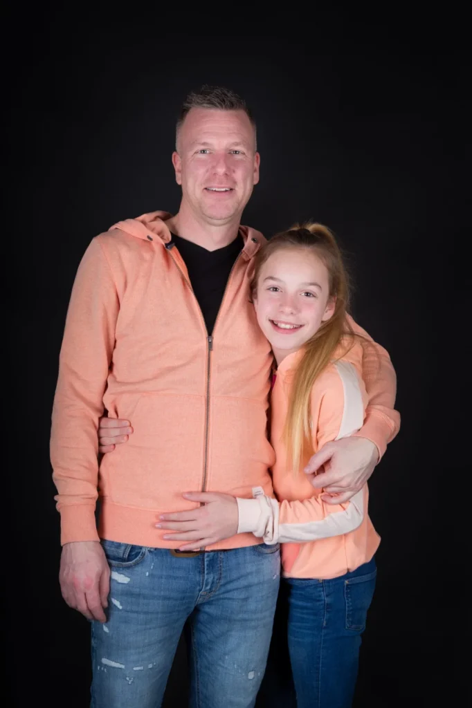 Vader en dochter samen op de foto tijdens een familie fotoshoot